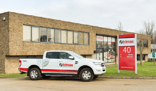 Trimax Headquarters with White Car about trimax mowing systems